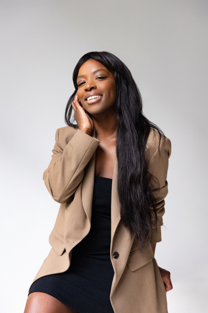 Ursula Lauriston black woman with hand on face professional