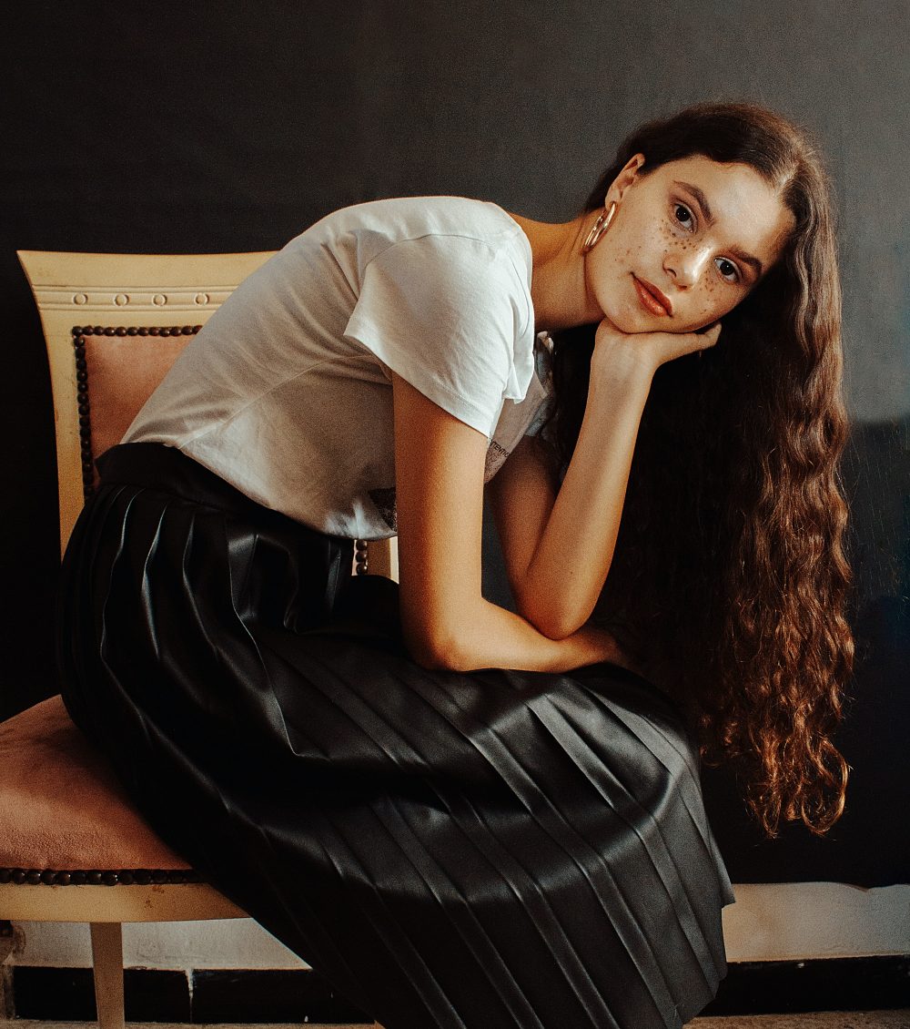 how-to-get-a-job-fast-under-30-days-career-woman-long-hair-sitting-on-chair