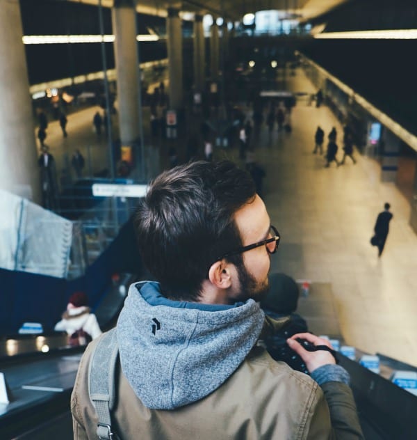 Annie-Spratt-note-to-your-future-self-man-airport-escalator