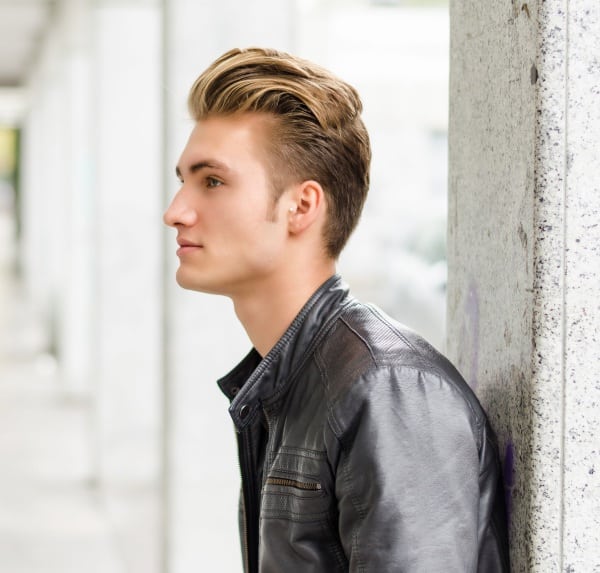 Dollarphotoclub-man-up-against-wall-white-male-blue-eyes-attractive-stress-releivers-over-worked-professional