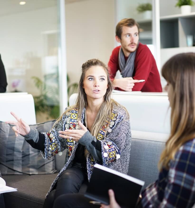Great-conversationalist-Photo-by-Robin-Yang-ita-olsen-woman-speaking-to-colleagues
