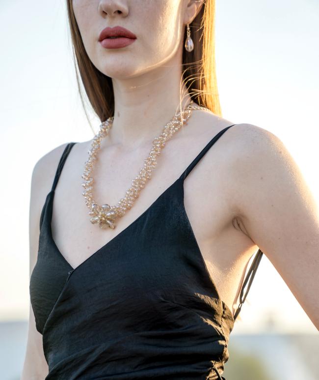 Woman-Wearing-Black-Spaghetti-Strap-Dress-and-Gold-colored-Necklace-net-worth-calculator-calculate-your-net-worth-definition-money-wealth-how-to