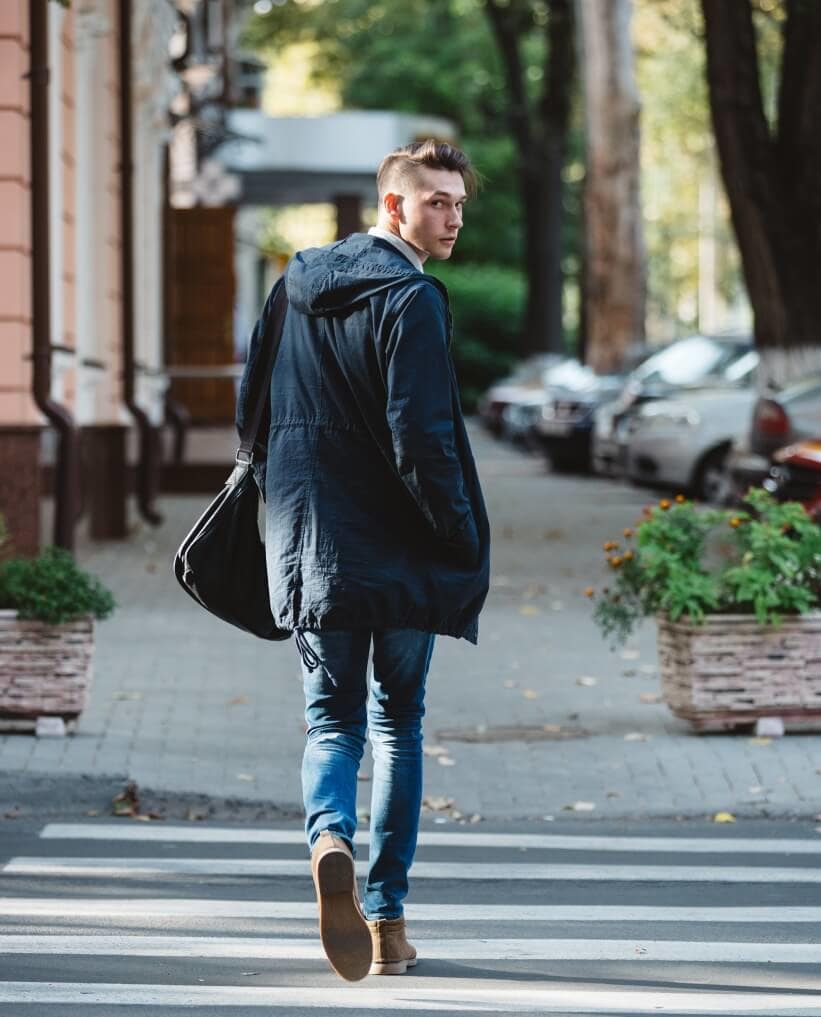 Young man cross the street before-you-quit-your-job-man-walking-looking-back-white-male-street-capitol-standard