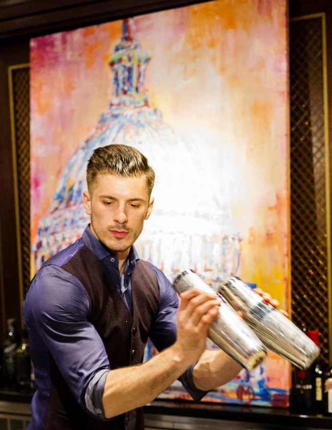 A bartender shakes drinks at the KIDDAR CAPITOL event