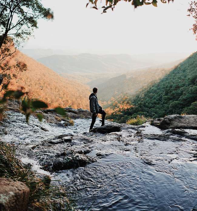 chris-fuller-capitol-standard-man-standing-mountains-river-what-is-a-foreign-service-officer