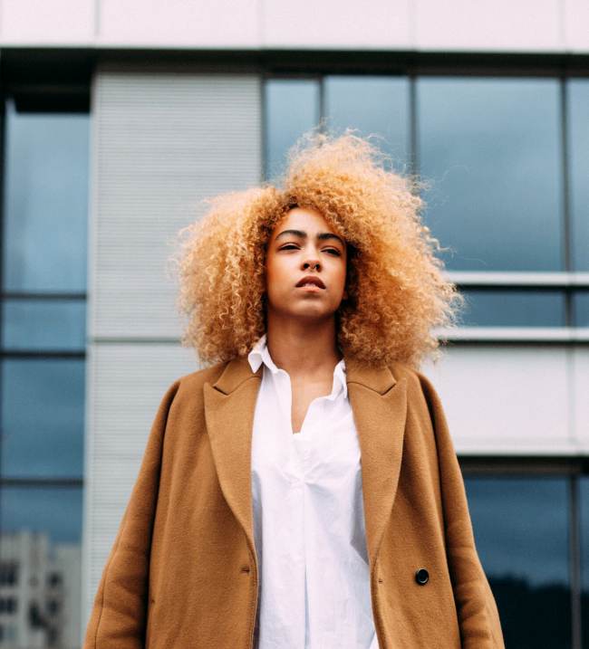 cortney-white-promotion-promoted-woman-black-curly-hair-natural