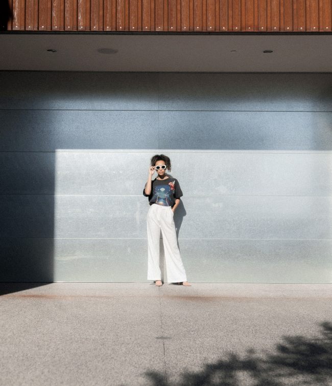 jakob-owens-financial-planning-process-black-woman-sunglasses-white-pants-planner-wealth-management