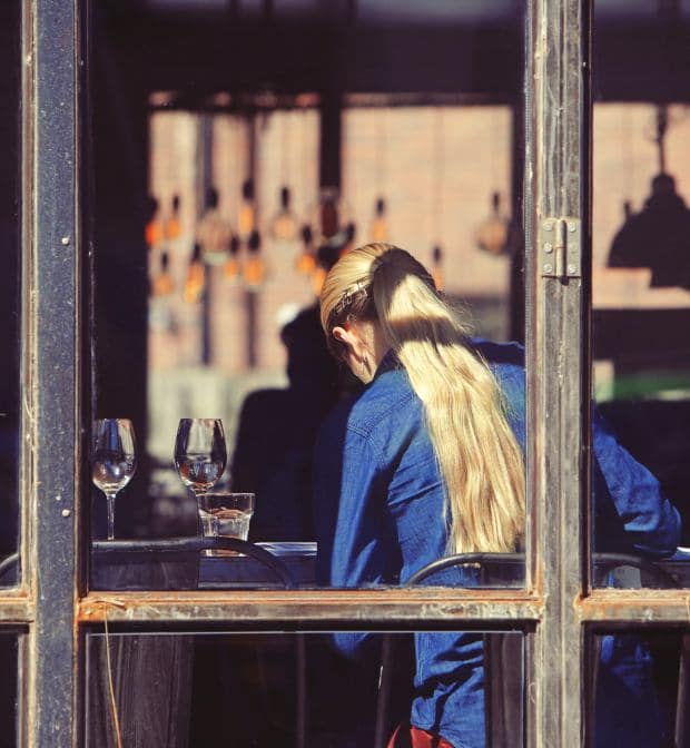 open-for-business-girl-in-window-millennial-starting-businesses-dc