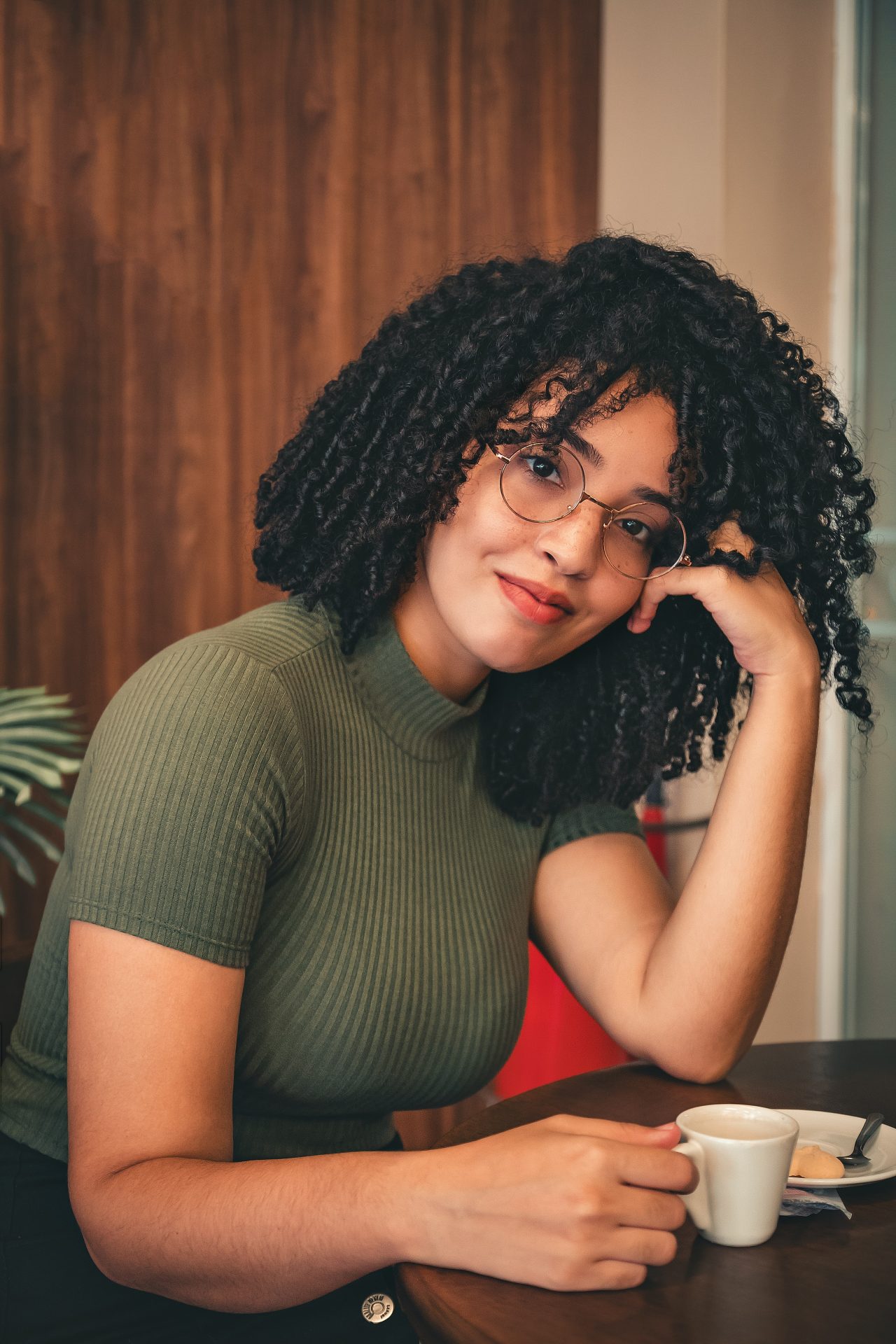 woman-in-green-crew-neck-t-shirt-sitting-by-the-table-personal-branding-make-money-side-hustle-start-blog