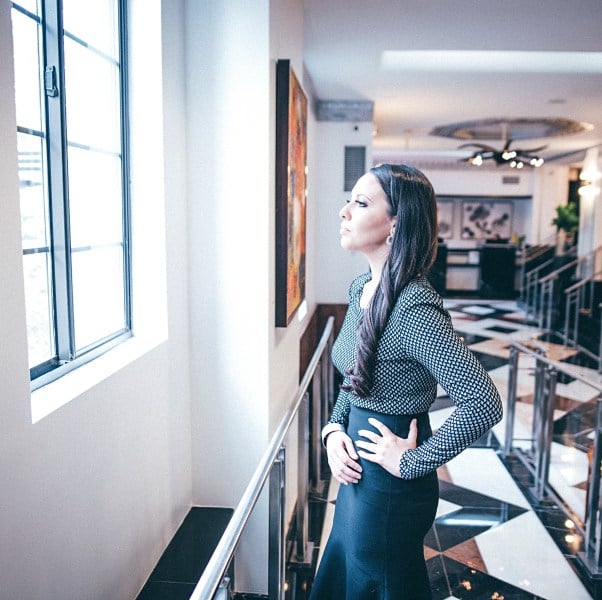 woman-looking-out-window-hotel-dc-washington-find-your-passion