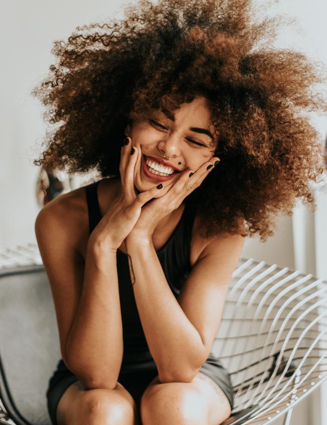 woman-sitting-and-smiling-year-in-review-top-news-stories
