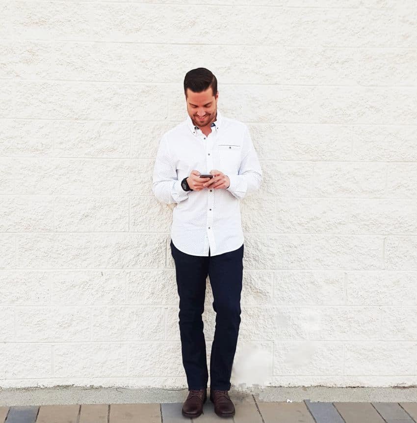 young-man-leverage-my-network-make-more-money-white-male-looking-phone-capitol-standard