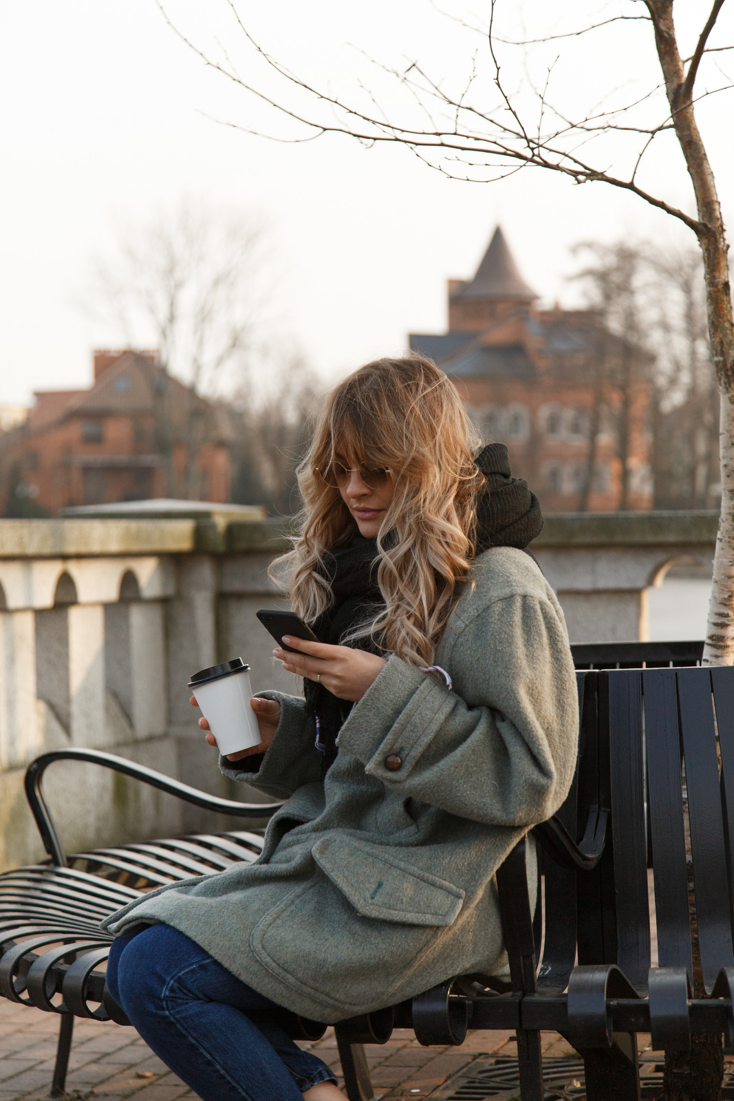 thank-you-email-after-phone-interview-woman-sitting-phone-city